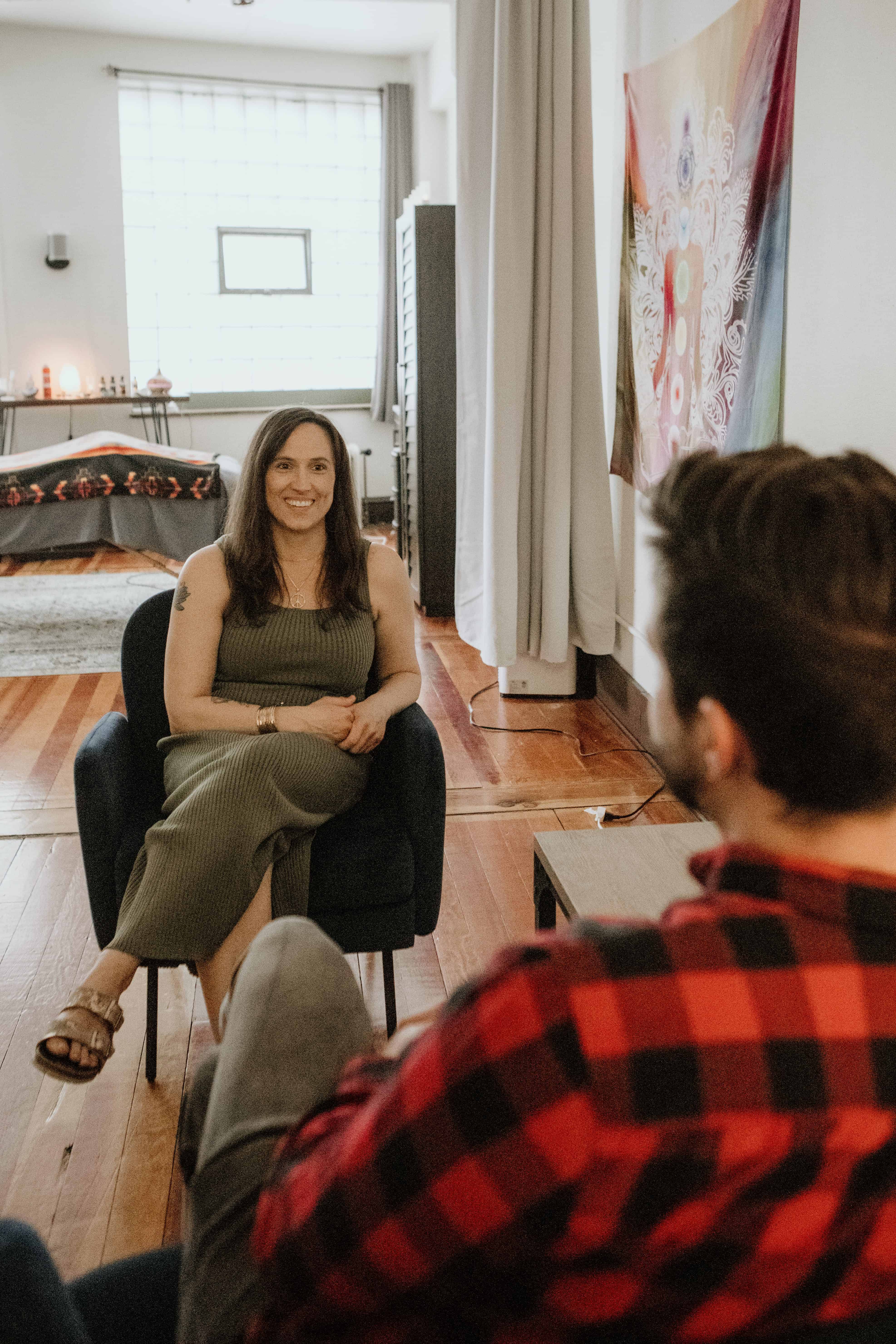 Leah listens to a client as he shares inner beliefs 