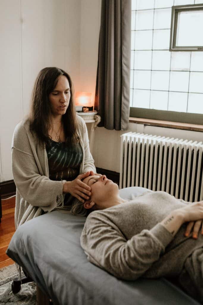 Leah helps a client destress during a cranial massage 